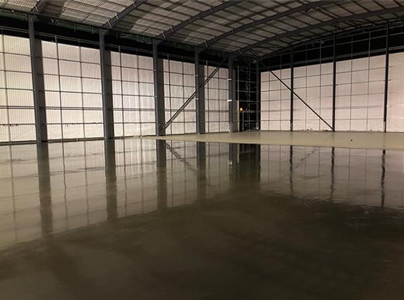 Industrial flooring specialists UK. Concrete flooring. Trust Construction. Completed warehouse floor.